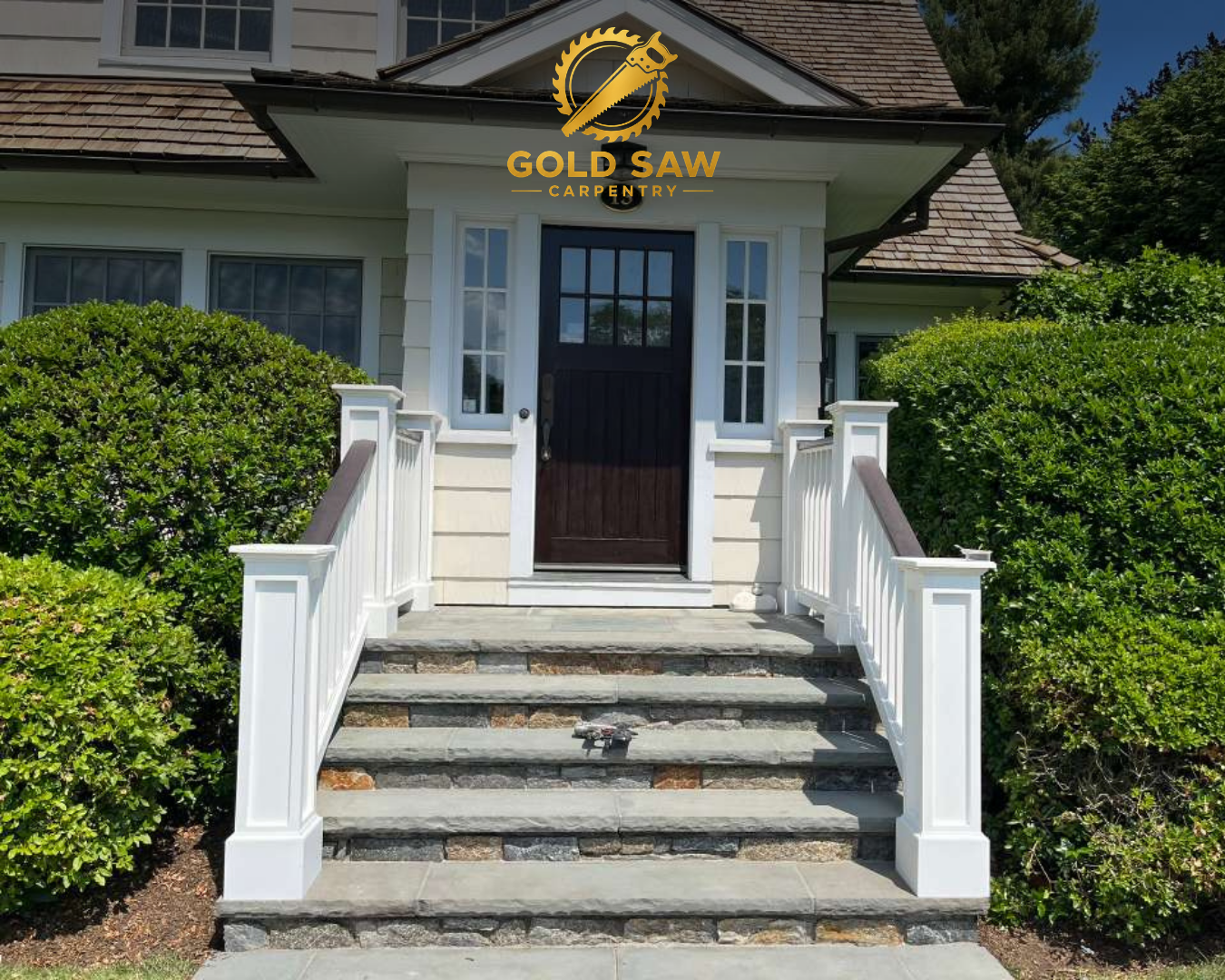 Custom front entrance staircase and railing by Gold Saw Carpentry